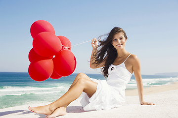 Image showing Girl with red balloons