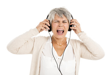 Image showing Elderly woman listen music