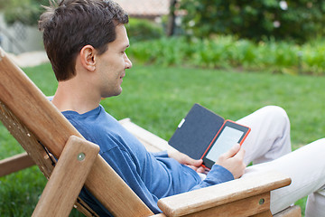 Image showing relaxing man reading