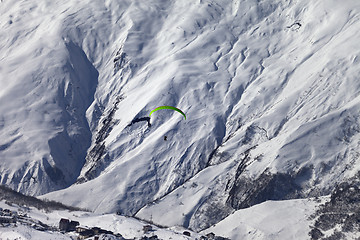 Image showing Speed flying in snow mountains in sunny nice day