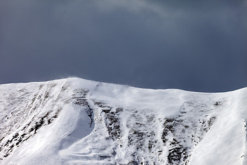 Image showing Off-piste slope and storm gray clouds