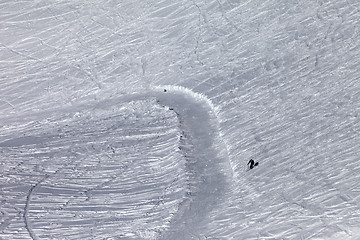 Image showing Skier on off-piste slope in sun day