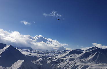 Image showing Helicopter above snowy plateau