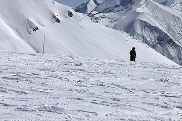 Image showing Ski trail and snowboarder in sun nice day