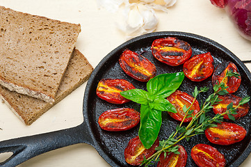 Image showing baked cherry tomatoes with basil and thyme