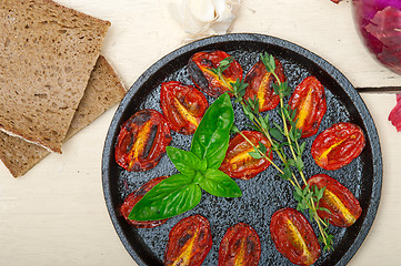 Image showing baked cherry tomatoes with basil and thyme