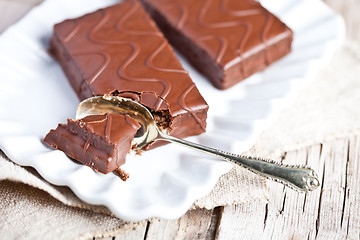 Image showing dark chocolate cakes and spoon