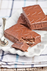 Image showing dark chocolate cakes and spoon