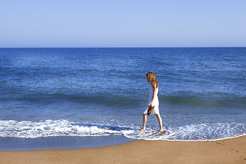 Image showing Holidaymaker with feet in wate