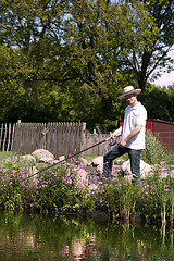 Image showing Fishing man at the pond