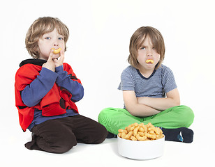 Image showing two boys with peanut puffs