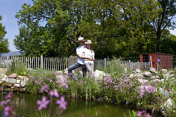 Image showing couple embracing at the pond