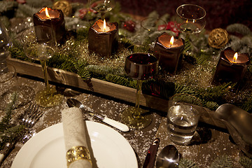 Image showing christmas laid table in the candlelight