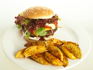 Image showing cheeseburger with potato wedges 