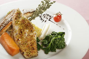 Image showing fish dish with spinach