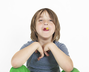 Image showing boy eats gummy bears