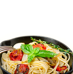 Image showing spaghetti pasta with baked cherry tomatoes and basil 