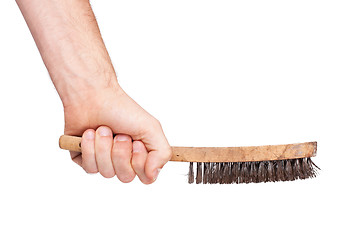 Image showing Isolated steel brush in male hand