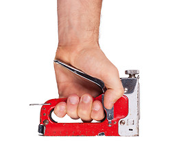 Image showing Staple gun in hand 