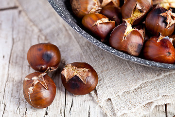 Image showing roasted chestnuts in a pan 