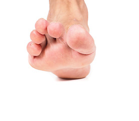 Image showing One single malefoot stepping towards, isolated on white