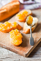 Image showing pieces of baguette with orange marmalade 