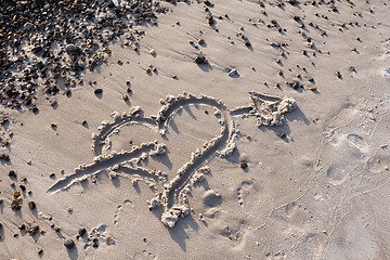Image showing Heart with Arrow in the sand