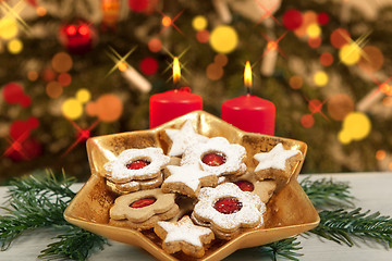 Image showing biscuits and candles under christmas tree