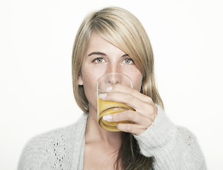 Image showing woman drinking orange juice