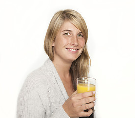 Image showing young woman with glass of juice