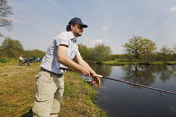 Image showing Fisherman with rod in the hand