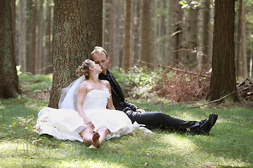 Image showing Bride kiss in the forest