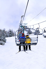 Image showing Skiers on chairlift