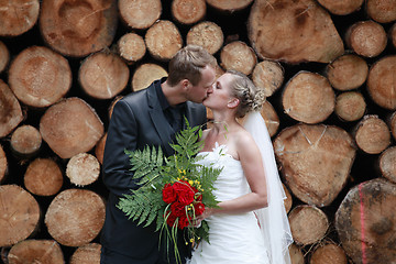 Image showing newlywed couple kissing