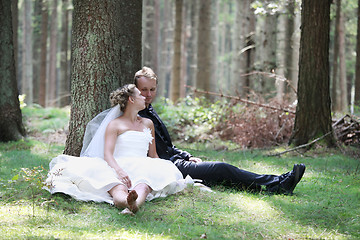 Image showing Bride and groom in forest