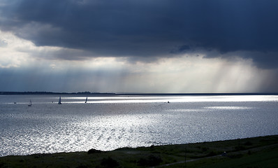 Image showing boats under dark sky