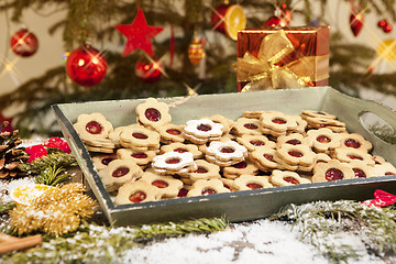 Image showing Cookies and gift under christmas tree