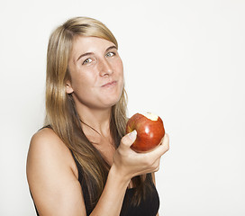 Image showing Woman eating apple