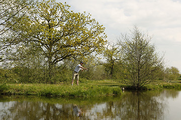 Image showing Fishermen throws the fishing rod