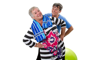 Image showing Two senior women making fitness exercises