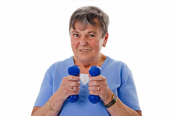 Image showing Senior woman exercising with dumbbells