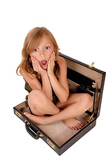 Image showing Girl sitting in briefcase.