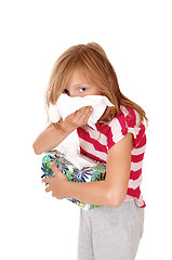 Image showing Girl blowing her nose.