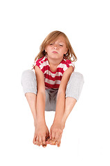 Image showing Mad girl sitting on floor.