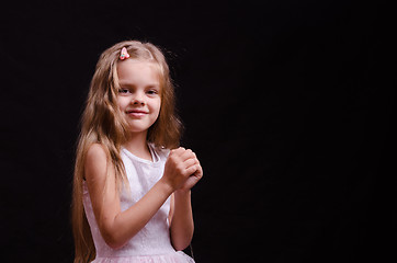 Image showing Happy little girl make a wish