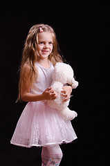 Image showing Joyful girl with teddy bear