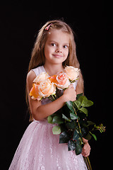 Image showing Five-year girl with a bouquet of flowers
