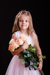 Image showing Happy five year old girl with a bouquet of flowers