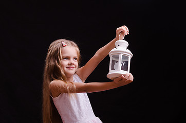 Image showing Five-year girl with candlestick in the hands of