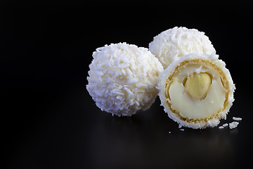 Image showing coconut balls on black background